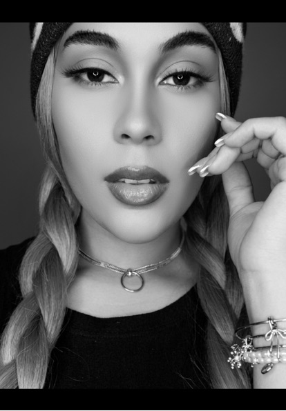 Black-and-white portrait of a woman wearing a headband