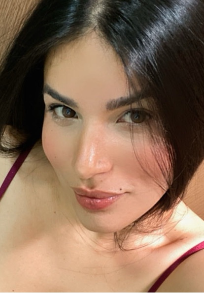 Close-up portrait of a woman with dark hair